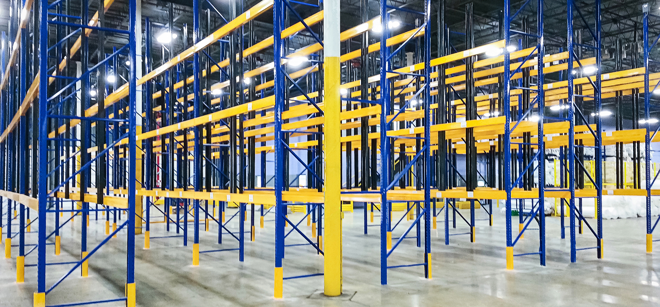 Custom colored galvanized pallet racks in a storage facility