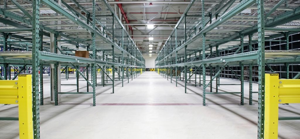 Warehouse with custom pallet racks, wire mesh decks, and safety equipment